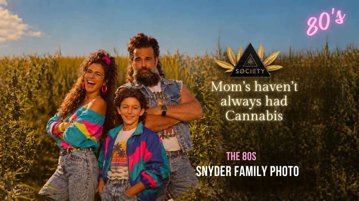 mom holding hemp plant in sunlit field at Society's Plant farm